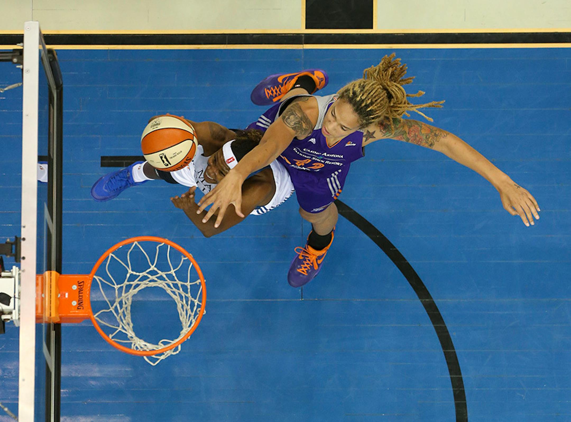 Lynx forward Rebekkah Brunson (32) made a first half shot under the defense of Phoenix Mercury center Brittney Griner (42) Thursday night at Target Center.