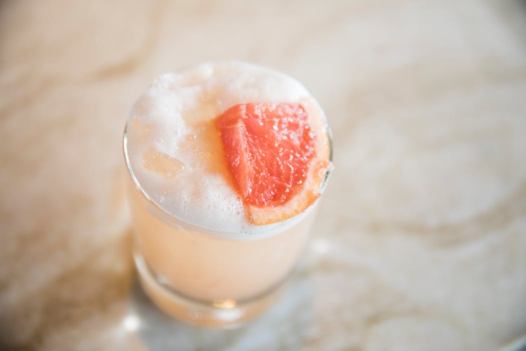 A cocktail made with baijiu, lychee liqueur, grapefruit, cinnamon and egg white at Jun in Minneapolis.