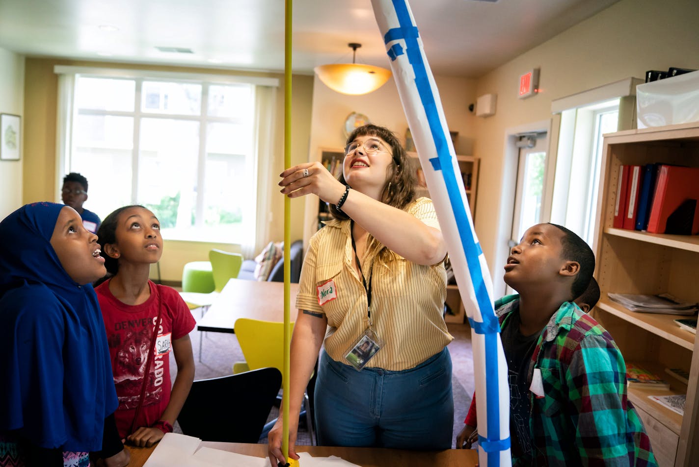 Kids in the Summer Fun program broke into groups to see who could make the tallest structure with only paper and tape. Kids discussed possible strategies and went to work building. Coordinator Nora Martin measured the structures at the end. ] GLEN STUBBE • glen.stubbe@startribune.com Monday, June 25, 2018 The Pohlad Family Foundation has regrouped and will now focus on housing instability. Letters went out to 54 organizations and nonprofits inviting them to apply for its first rounds of grants t