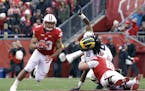 Wisconsin's Jonathan Taylor runs during an NCAA college football game against Michigan Saturday, Nov. 18, 2017, in Madison, Wis. (AP Photo/Aaron Gash)