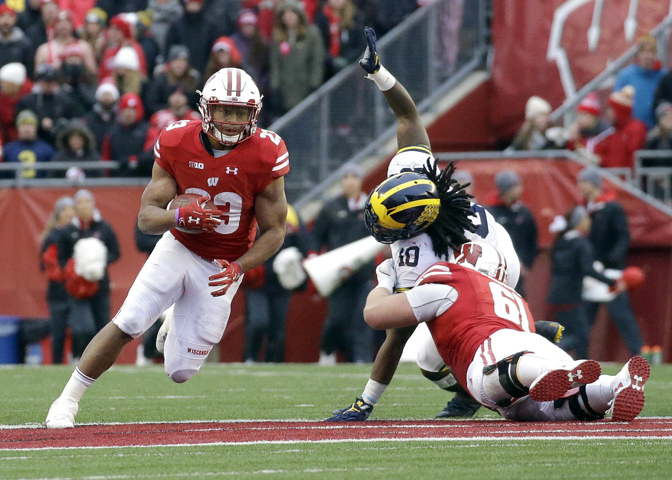 Wisconsin's Jonathan Taylor runs during an NCAA college football game against Michigan Saturday, Nov. 18, 2017, in Madison, Wis. (AP Photo/Aaron Gash)