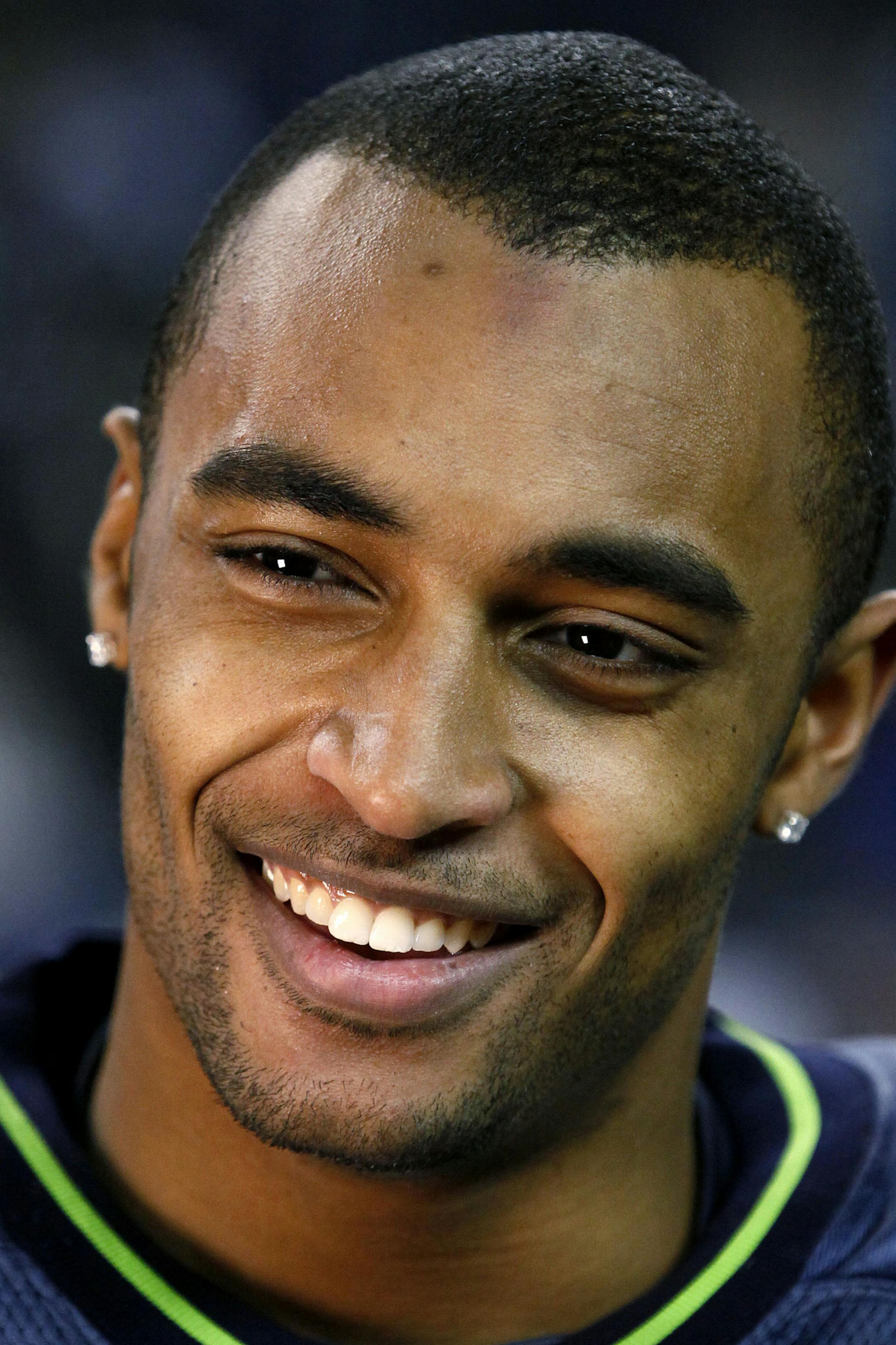 Seattle Seahawks wide receiver Doug Baldwin smiles after the team defeated the St. Louis Rams 30-13 in an NFL football game, Monday, Dec. 12, 2011, in Seattle. (AP Photo/Elaine Thompson)