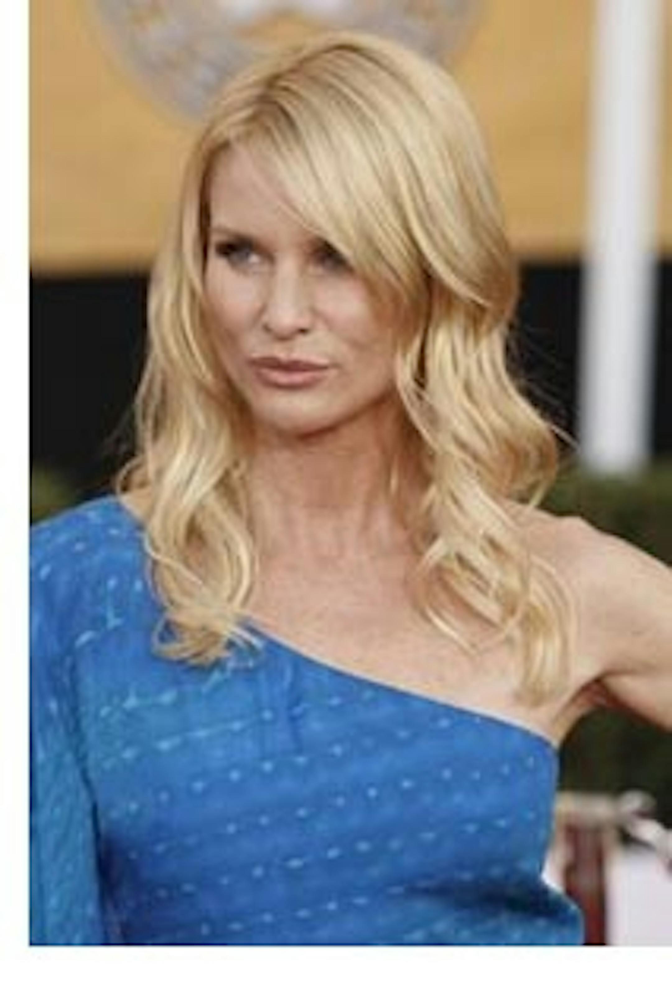 FILE - In this Jan. 25, 2009 file photo, Nicollette Sheridan arrives at the 15th Annual Screen Actors Guild Awards in Los Angeles. Sheridan appeared in a Los Angeles court Tuesday, May 3, 2011, when a judge said her wrongful termination case against ABC and "Desperate Housewives" creator Marc Cherry should go to trial. (AP Photo/Matt Sayles, File)