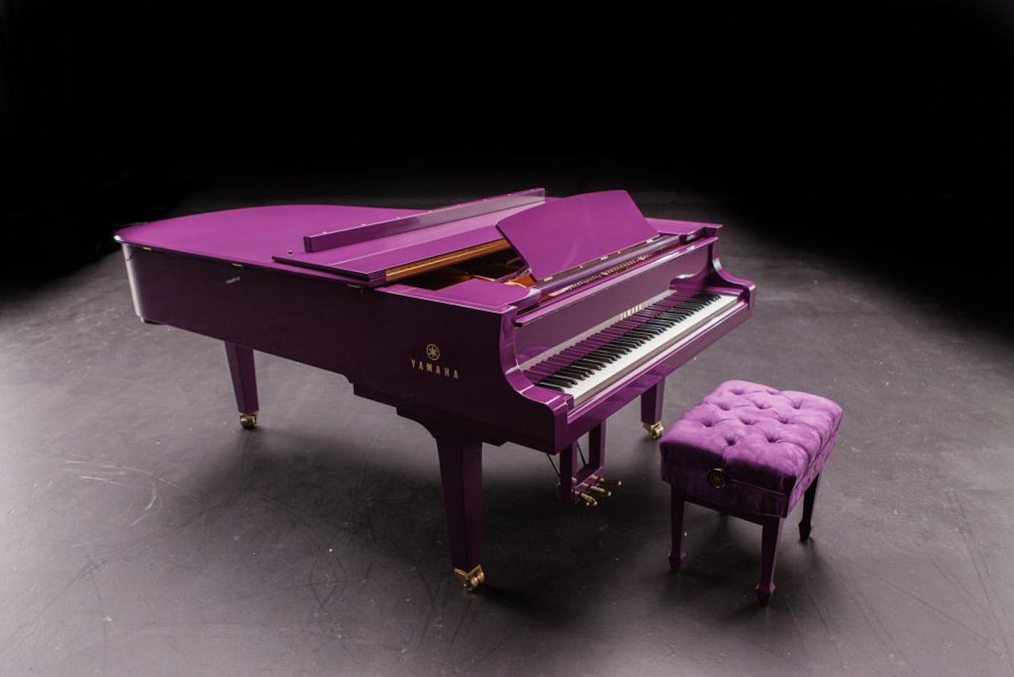 This undated photo released by Yamaha Entertainment Group shows a custom-made purple piano the company manufactured for musician Prince. Days before his death, Prince tweeted a photo of the piano intended to be a centerpiece of his scheduled tour. The acoustics of the piano were fine-tuned to Prince's specifications. The artist, 57, who was found dead in his suburban Minneapolis home Thursday, April 21, 2016, had intended it for his Prince, Piano and a Microphone tour.