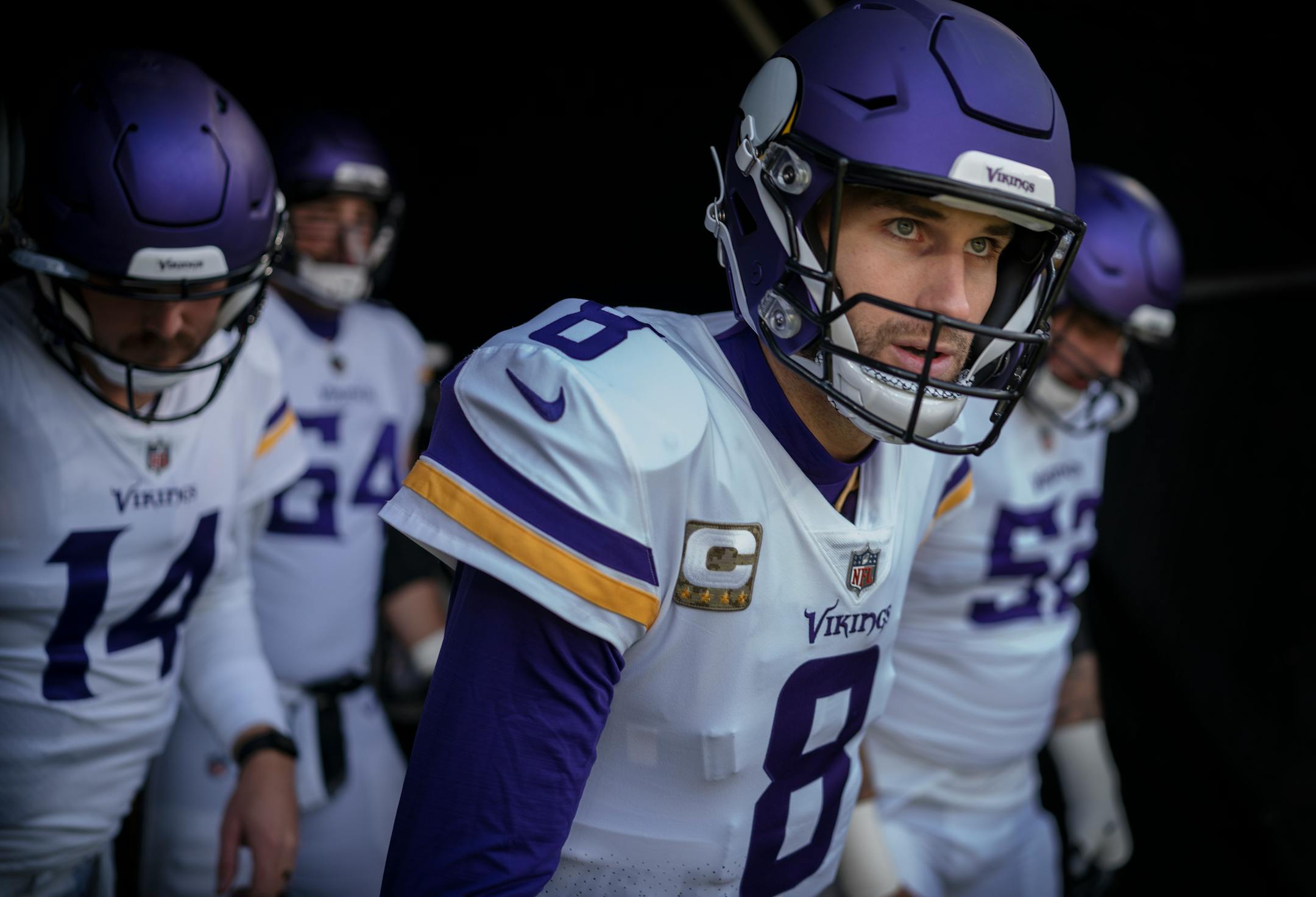 Minnesota Vikings quarterback Kirk Cousins ,(8) and teammates take the field for warm ups, in Baltimore, Md., on Sunday, Nov. 7, 2021.