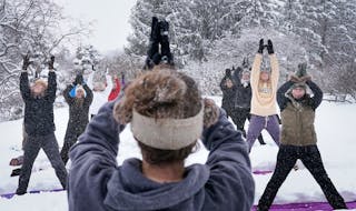 As part of the Yoga in the Gardens series, instructor Jenn Holm of Yoga 4 You, led participants in Snowga at the Lilac Walk in the Minnesota Landscape