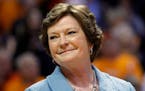 In this Jan. 28, 2013, file photo, former Tennessee women's basketball coach Pat Summitt smiled as a banner is raised in her honor before the team's N