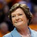 In this Jan. 28, 2013, file photo, former Tennessee women's basketball coach Pat Summitt smiled as a banner is raised in her honor before the team's N
