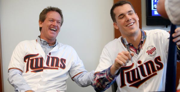 New Minnesota Twins pitching coach Neil Allen signed autographs along with Twins pitcher Alex Meyer, right, at Twinsfest Saturday, Jan. 24, at Target 