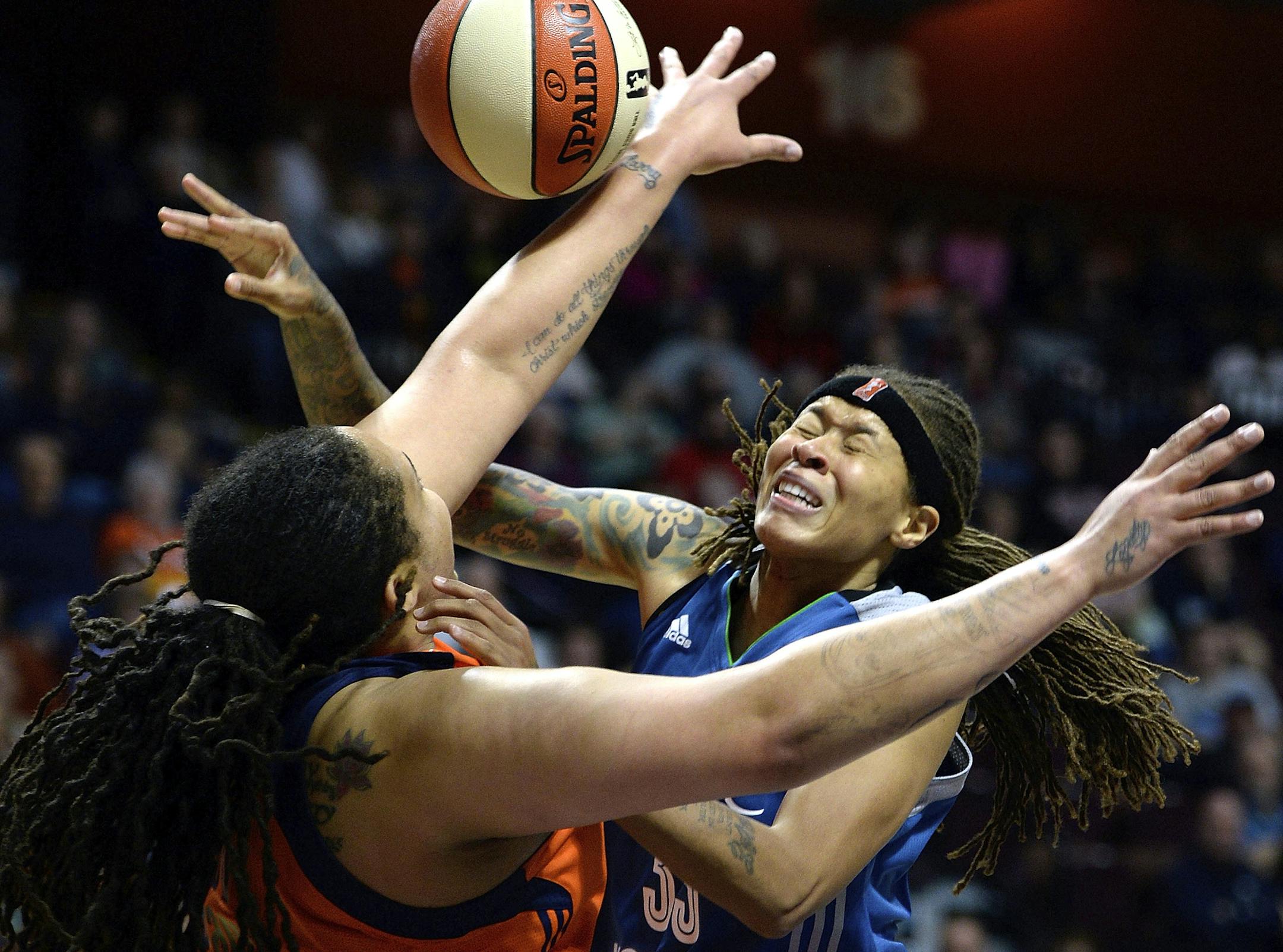 Minnesota Lynx's Seimone Agustus, right, is fouled by Connecticut Sun's Danielle Adams in the second half of a WNBA basketball game Friday, May 26, 2017, in Uncasville, Conn. (Sean D. Elliot/The Day via AP)