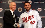 Twins general manager Terry Ryan shook hands with free-agent Ricky Nolasco after his signing was announced before the 2014 season. Nolasco has been in