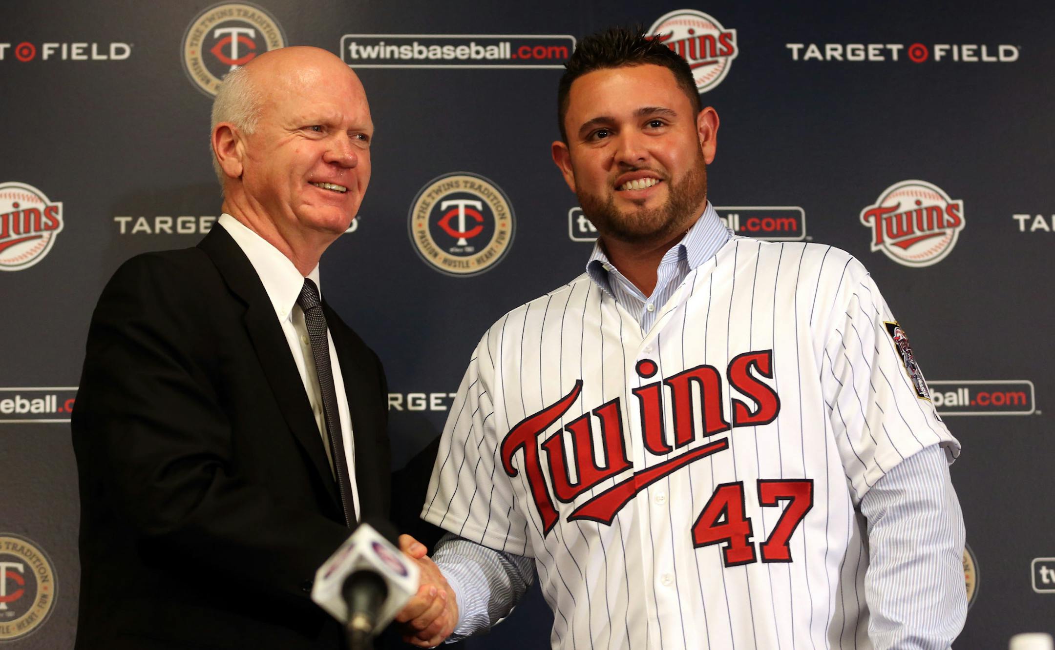 Twins general manager Terry Ryan shook hands with free-agent Ricky Nolasco after his signing was announced before the 2014 season. Nolasco has been injured and, moreoften than not, pitched poorly.