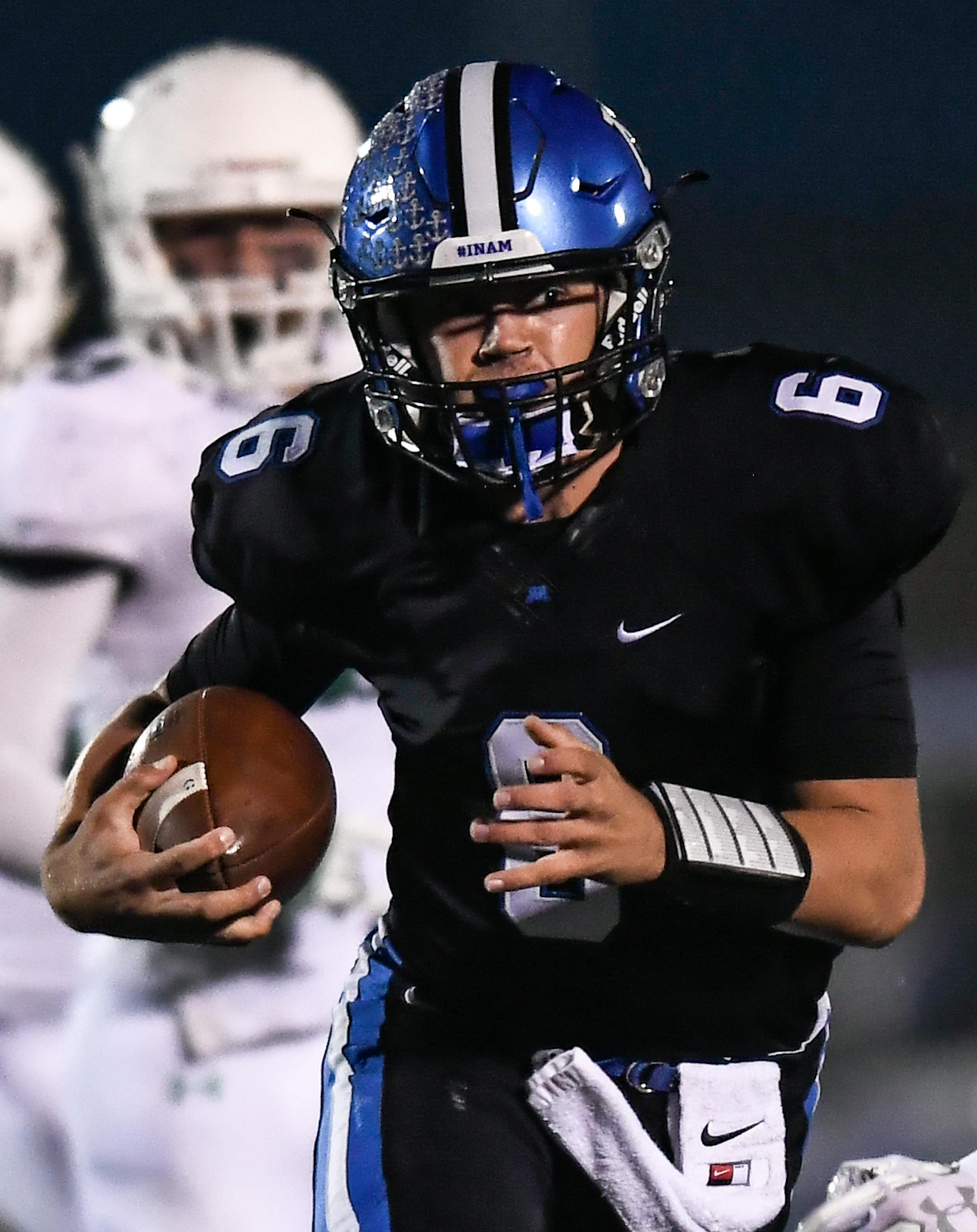 Minnetonka quarterback Aaron Syverson (6) rushed the ball in the first quarter against Edina. ] AARON LAVINSKY ï aaron.lavinsky@startribune.com Minnetonka played Edina in a high school football game on Friday, Oct. 6, 2017 at Minnetonka High School in Minnetonka, Minnesota.