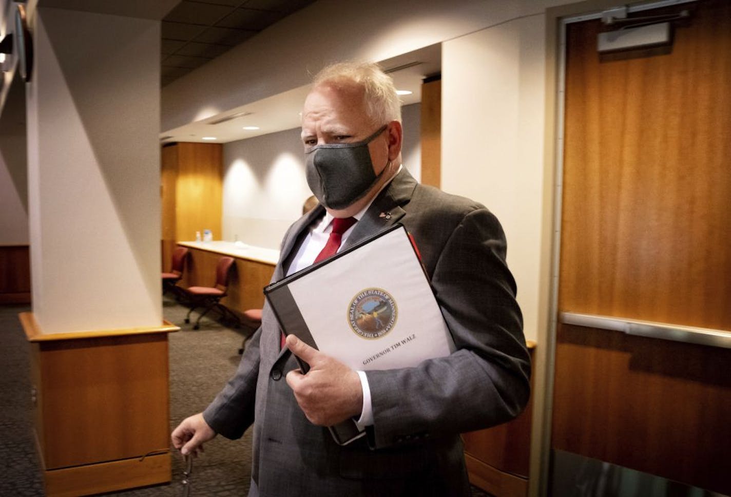 Minnesota Gov. Tim Walz walks after providing an update on the state's plan to mitigate the impact of COVID-19 in long-term care facilities Tuesday, July 21, 2020. Walz also addressed the legislature's failure to pass a bonding bill Monday night.