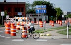 A bicyclist made her way across a very busy 2nd Street West, Monday, June 13, 2016 in Northfield, MN. The Northfield intersection now has radar instal