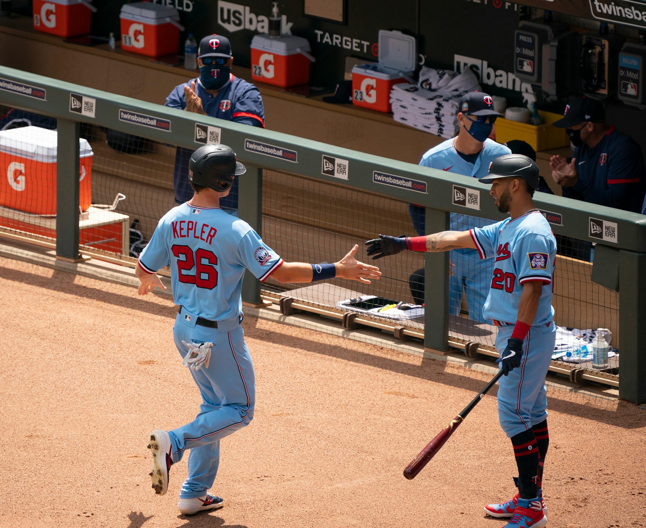 Minnesota Twins right fielder Max Kepler (26) was congratulated by Eddie Rosario (20) after scoring on a first inning single by Jorge Polanco.