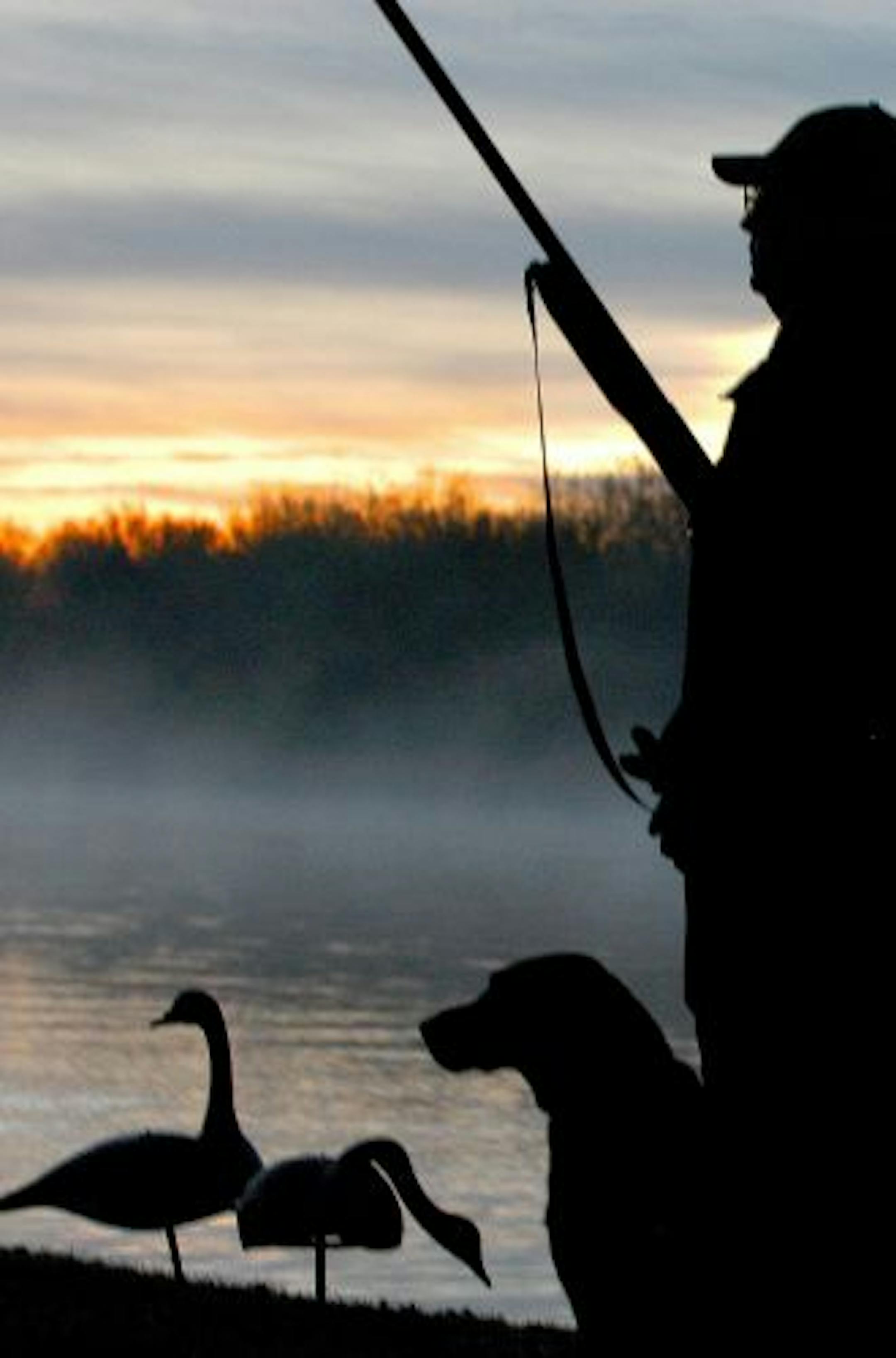 Joel Bennett of Sunfish Lake (in silhouette) hopes the next generation of hunters will have ducks aplenty.