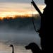 Joel Bennett of Sunfish Lake (in silhouette) hopes the next generation of hunters will have ducks aplenty.