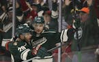 Minnesota Wild right wing Nino Niederreiter (22) was congratulated by Jason Pominville (29) after he scored an empty net goal in the third period last