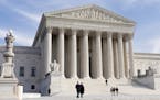 FILE - In this Jan. 25, 2012 file photo, the U.S. Supreme Court Building is seen in Washington. The health insurance industry is spending millions to 