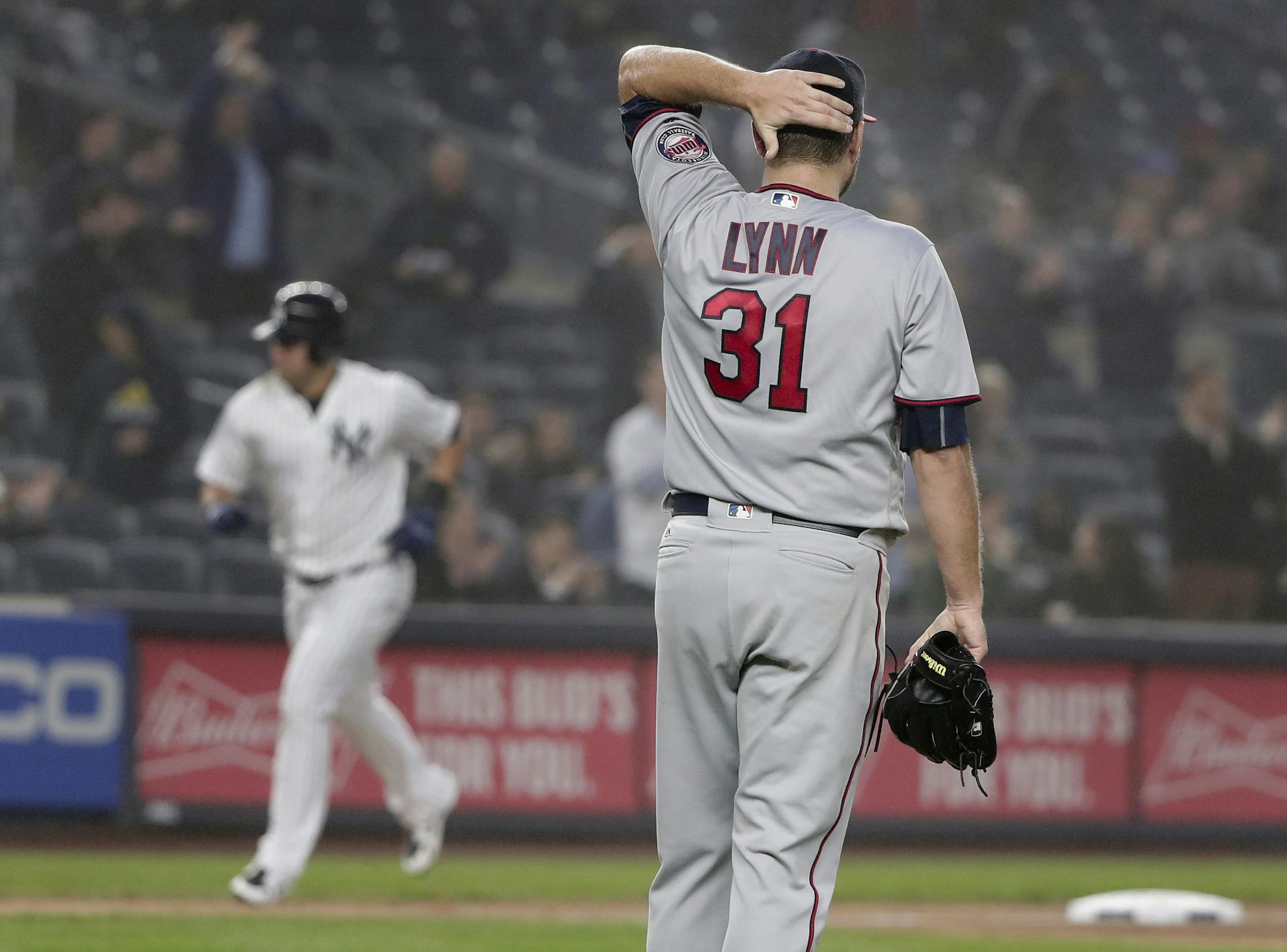 Minnesota Twins pitcher Lance Lynn (31) adjusts hit cap after giving up a three-run home run to New York Yankees' Tyler Austin during the third inning of a baseball game, Wednesday, April 25, 2018, in New York.