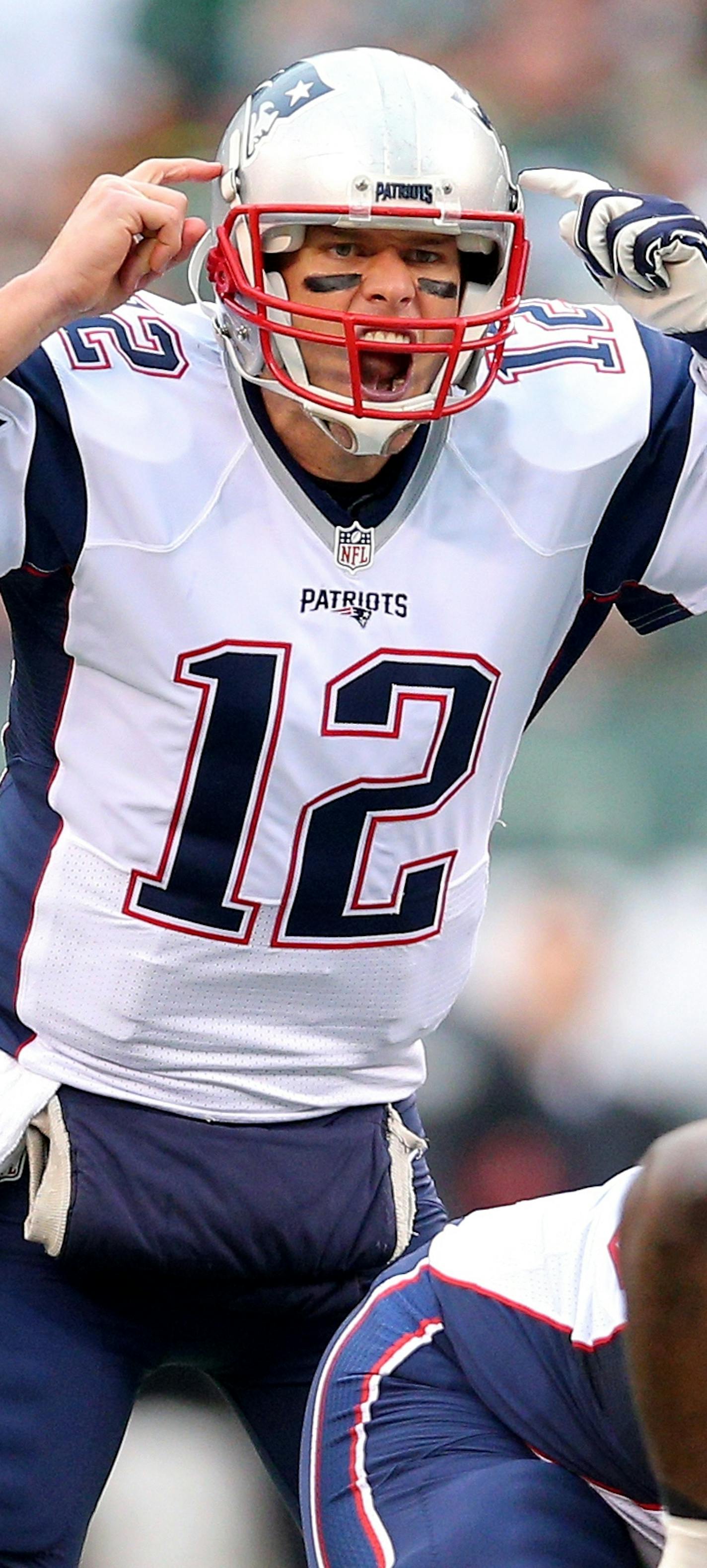 New England Patriots quarterback Tom Brady (12) signals at the line against the New York Jets during an NFL game at MetLife Stadium in East Rutherford, N.J. on Sunday, Dec. 27, 2015. (AP Photo/Brad Penner) ORG XMIT: BPNY101