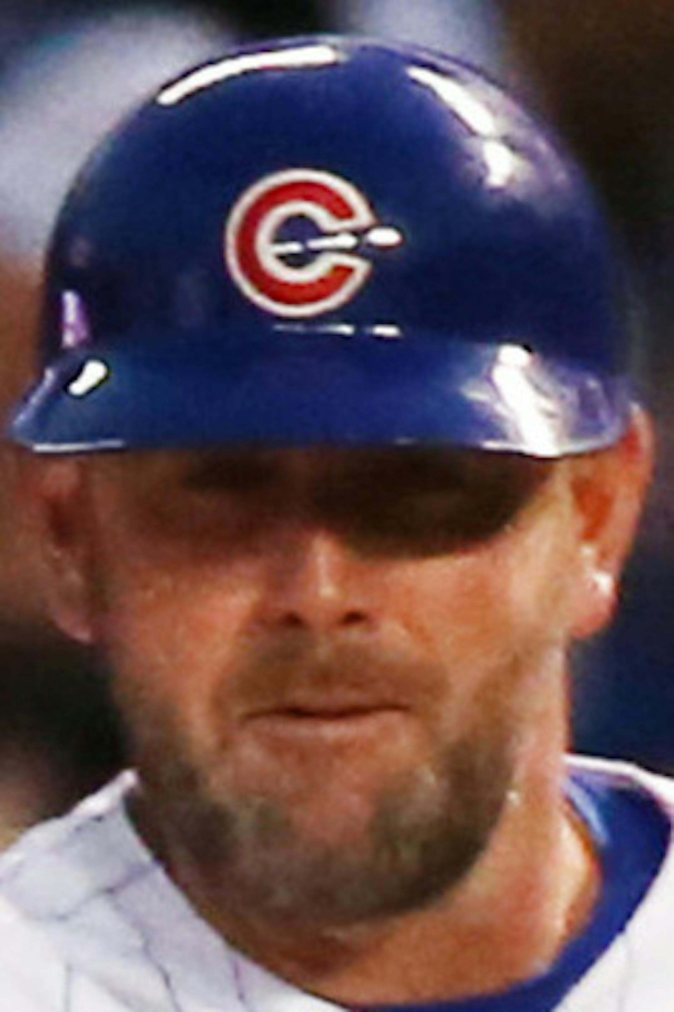 Chicago Cubs left fielder Kyle Schwarber (12) high-fives Chicago Cubs first base coach Brandon Hyde (16) after his solo home run against the St. Louis Cardinals during the fourth inning on Sunday, July 23, 2017 at Wrigley Field in Chicago, Ill. Baltimore Orioles executive vice president and general manager Mike Elias on Tuesday denied he'd selected Chicago Cubs bench coach Brandon Hyde as his new manager. (Nuccio DiNuzzo/Chicago Tribune/TNS)