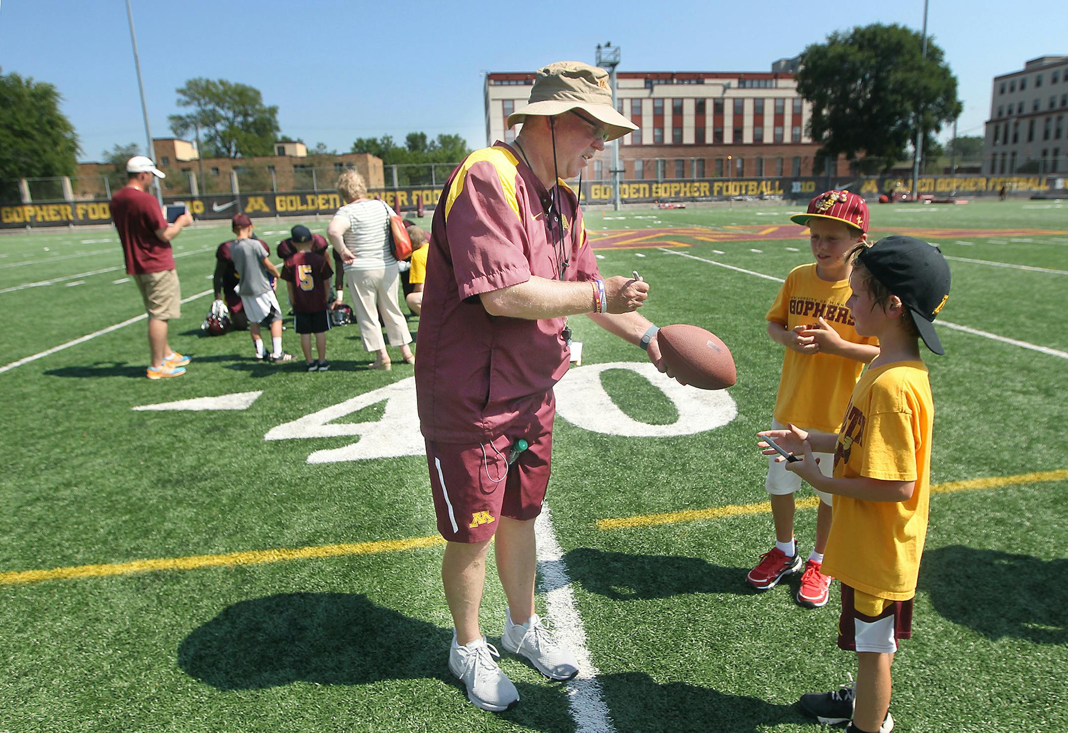 Minnesota's Head Coach Jerry Kill signed autographs for kids after practice, Friday, August 14, 2015 at Nagursk field at the U of M in Minneapolis, MN. ] (ELIZABETH FLORES/STAR TRIBUNE) ELIZABETH FLORES &#x2022; eflores@startribune.com