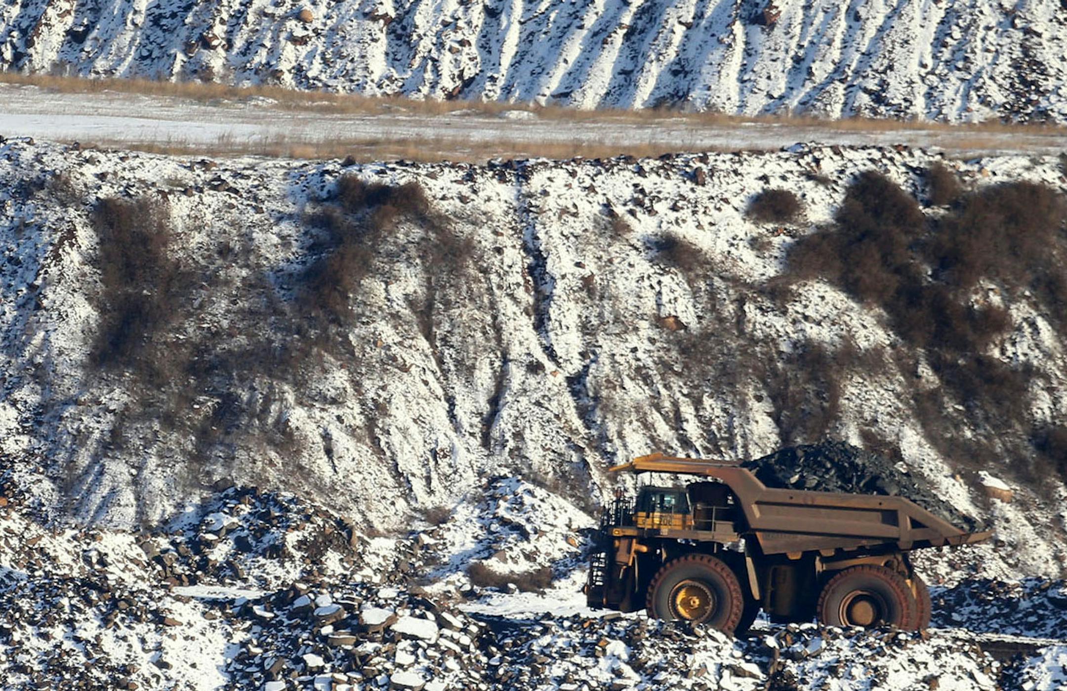 A view of Hull Rust Mine: the world's largest open pit mine, where a giant truck is seen carrying iron ore rocks Tuesday, Nov. 24, 2015, in Hibbing, MN.](DAVID JOLES/STARTRIBUNE)djoles@startribune.com Idled on the Iron Range, workers and entire communities are struggling at a time when the rest of Minnesota is enjoying peace and plenty. The Range has always been a land of booms and busts, but the latest downturn has stretched on so long the governor is calling for a special session to extend une