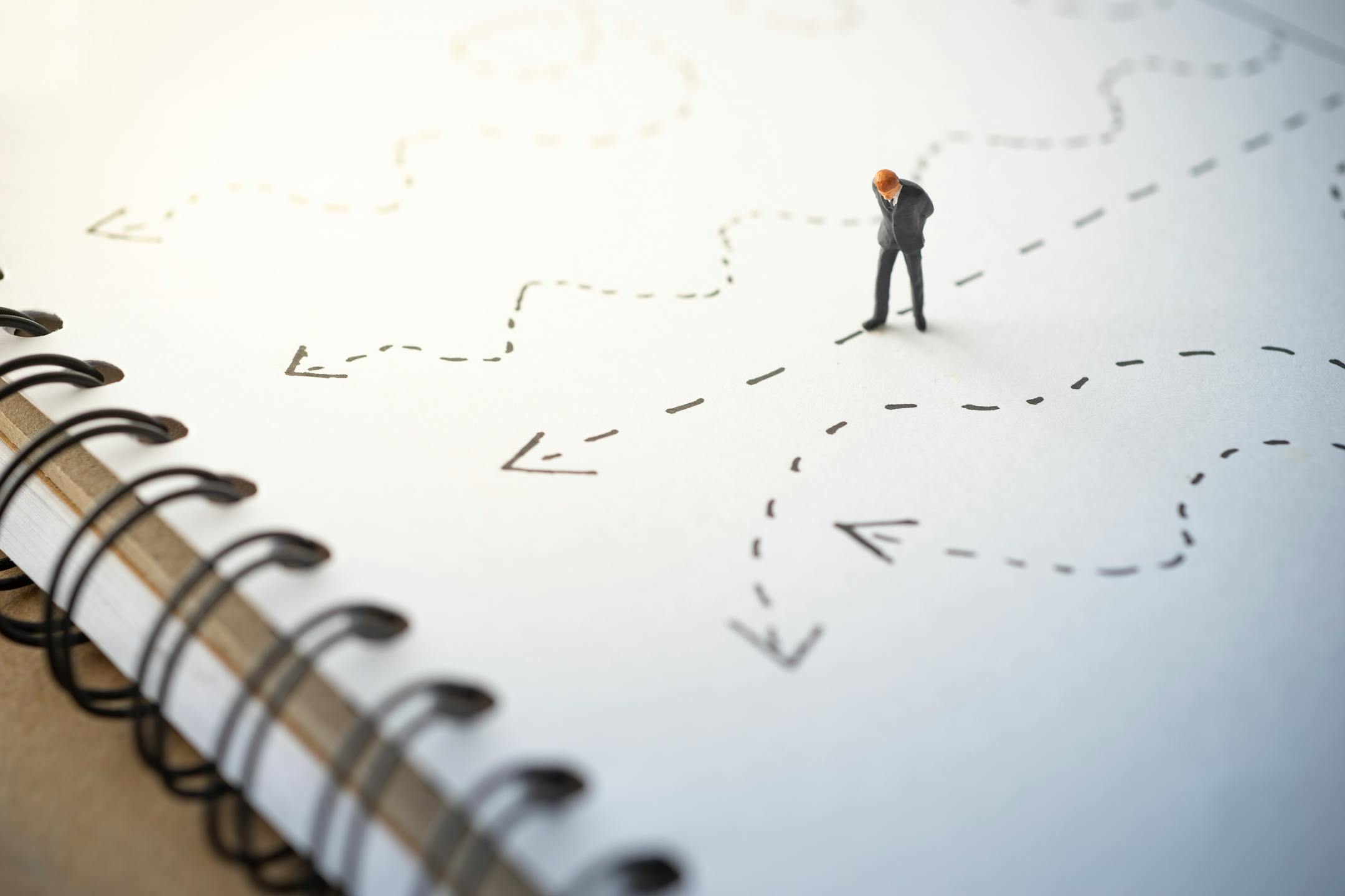 Business decision concept. Businessman thinking with many arrow path.