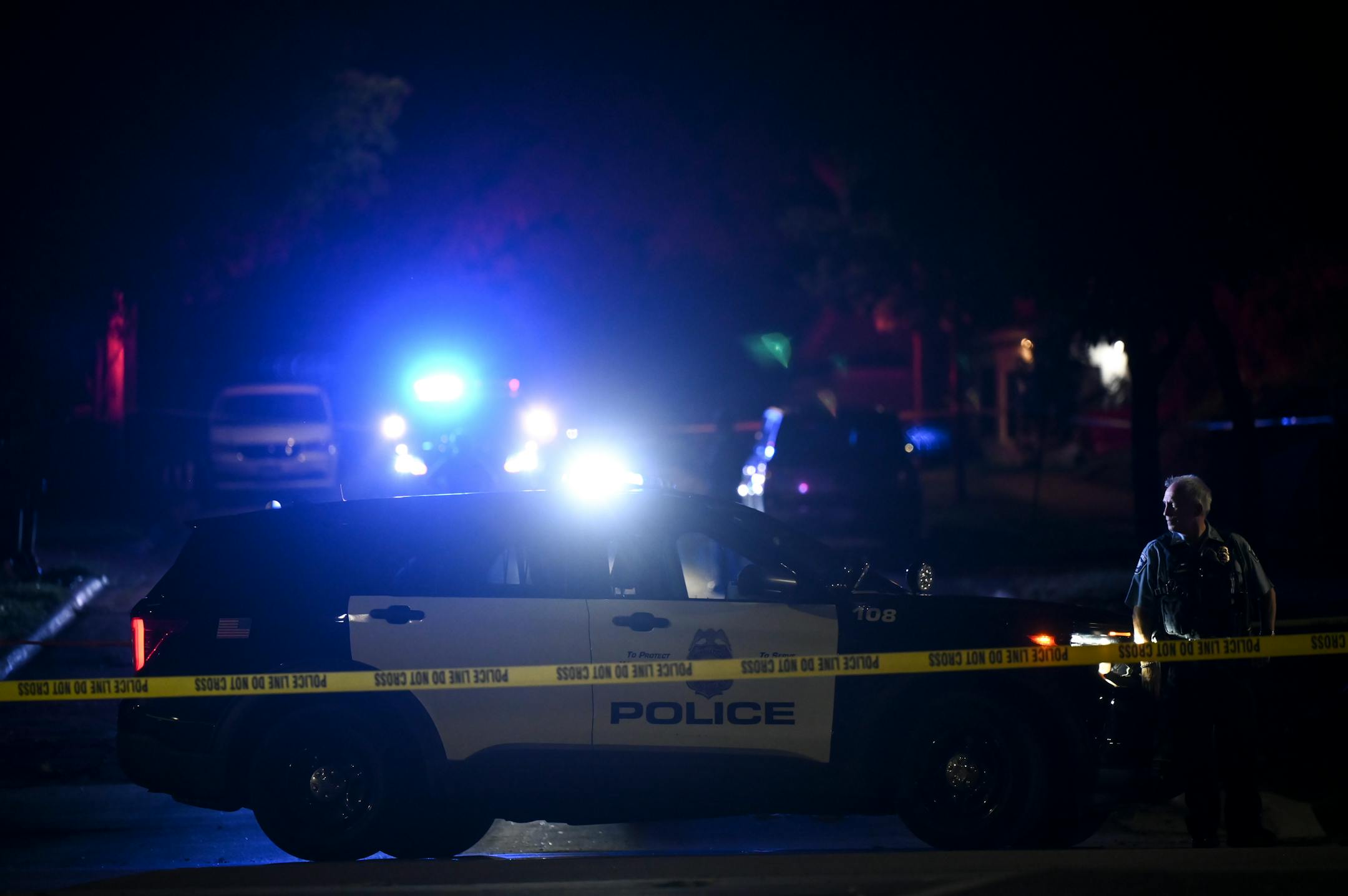 Police shut down roads near where a Minneapolis Police Officer was shot earlier in the night near Webber Parkway and Colfax Avenue North Friday, Aug. 11, 2023 in Minneapolis, Minn. ] AARON LAVINSKY • aaron.lavinsky@startribune.com