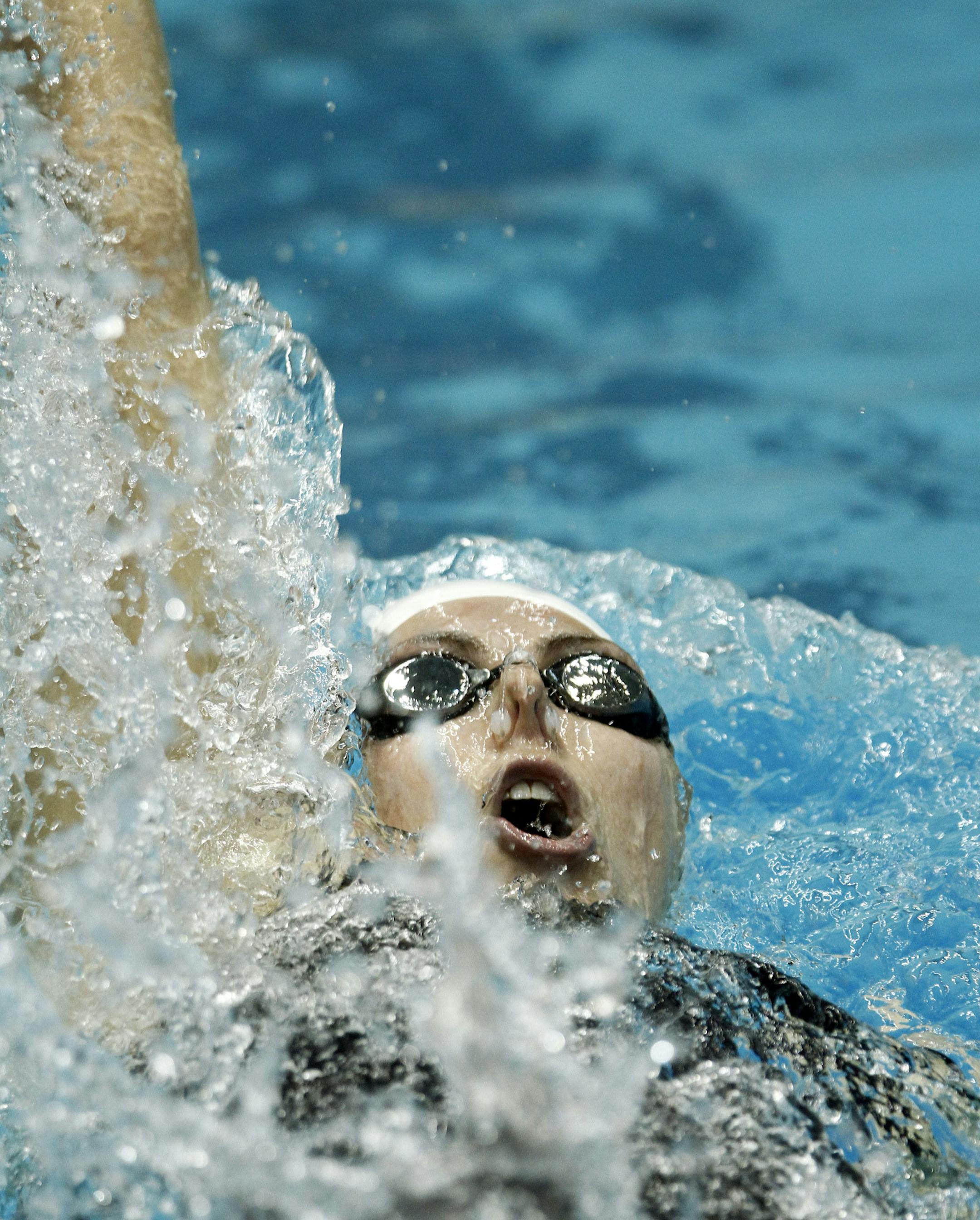 Missy Franklin competes in the preliminary round of the women's 200-yard backstroke race at the Winter National Championship swimming competitioon Saturday, Dec. 7, 2013, in Knoxville, Tenn. (AP Photo/Wade Payne) ORG XMIT: TNWP101