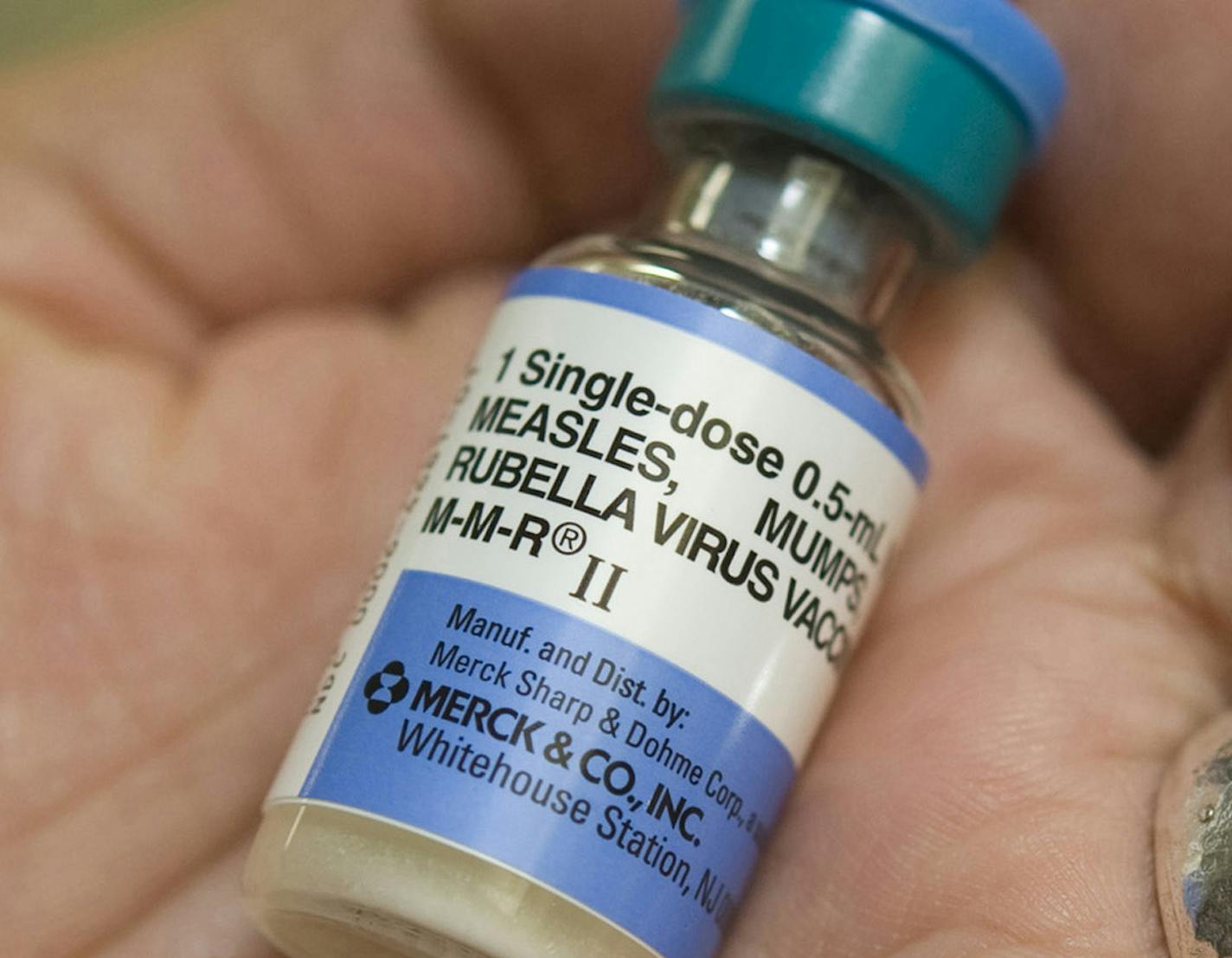 Dr. Shruti K. Gohil, associate medical director for epidemiology and infection prevention at UCI Medical Center, holds a dose of MMR, the vaccine against measles, mumps and rubella. (Ana Venegas/Orange County Register/TNS) ORG XMIT: 1163174 ORG XMIT: MIN1501282305177647 ORG XMIT: MIN1502031200399233