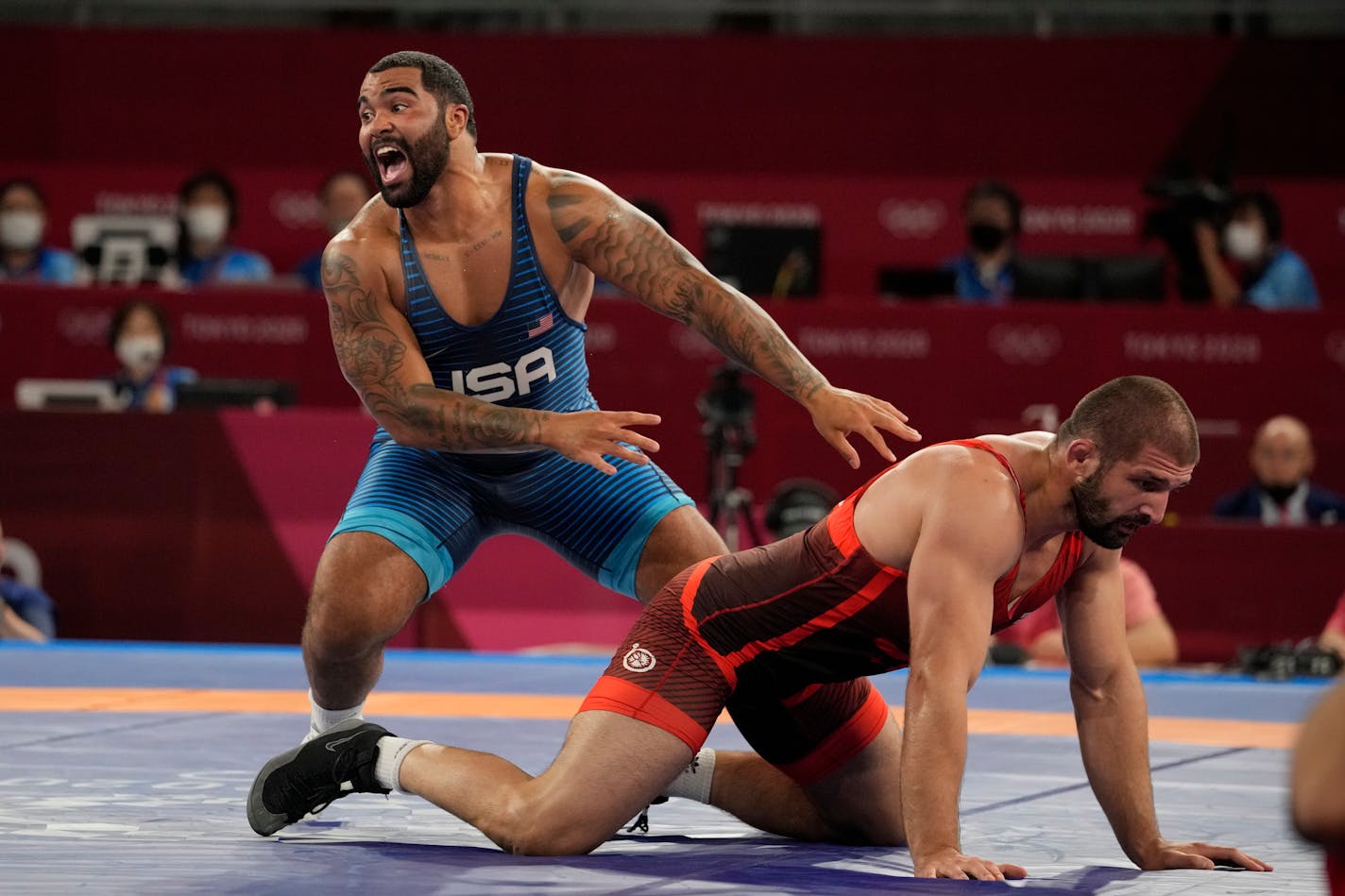 Gable Dan Steveson, left, celebrates after winning the gold medal at the 2020 Summer Olympics