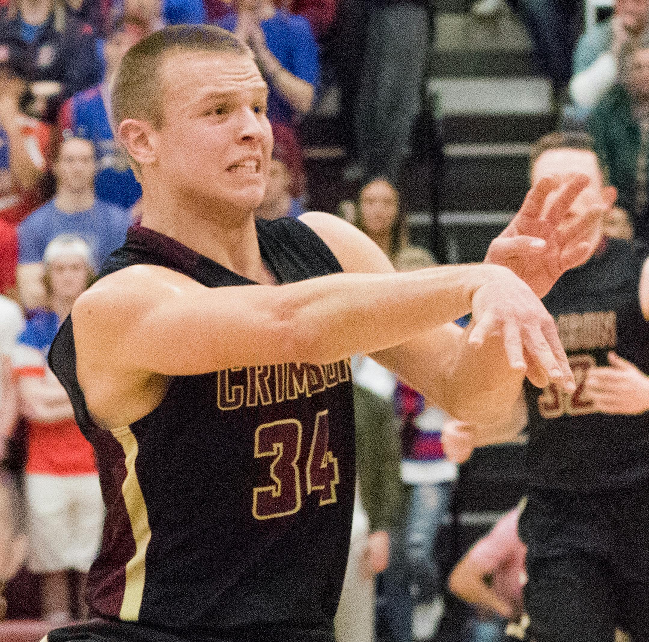 Maple Grove high school basketball player Brad Davison (34) tossing the ball away during the second quarter of a boys prep basketball game at Maple Grove High School. ] MATT WEBER ï