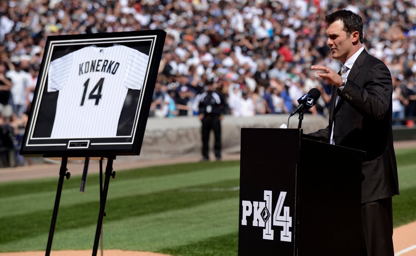 Former Chicago White Sox player Paul Konerko speaks during a ceremony retiring his No. 14 at U.S. Cellular Field before a baseball game between the White Sox and the Minnesota Twins in Chicago, Saturday, May 23, 2015. (AP Photo/Paul Beaty)