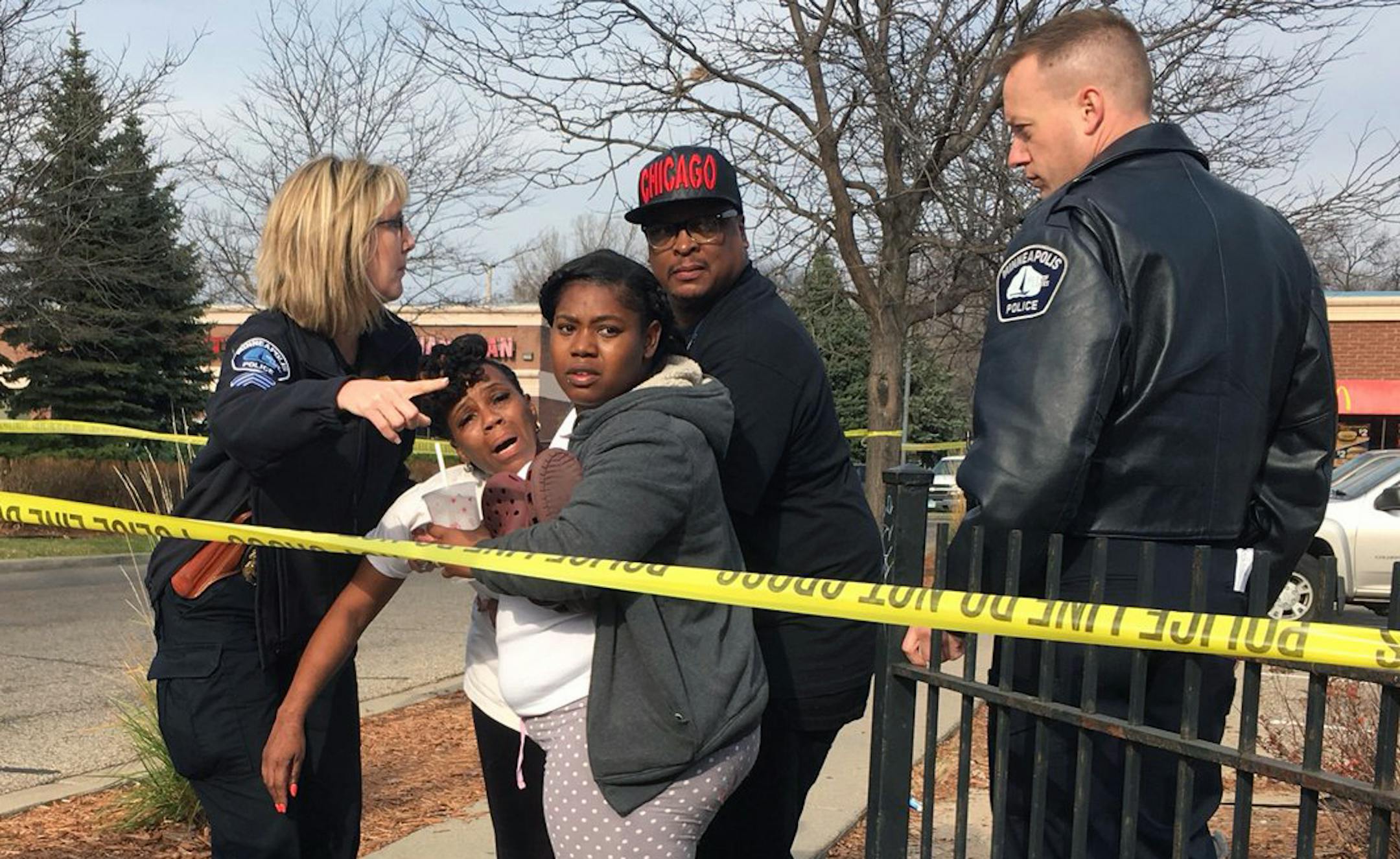 Minneapolis police are investigating a homicide along a busy thoroughfare on the city's north side Thursday. A woman, who identified herself as the victim's mother, was consoled at the scene by officers and K.G. Wilson, a local activist.