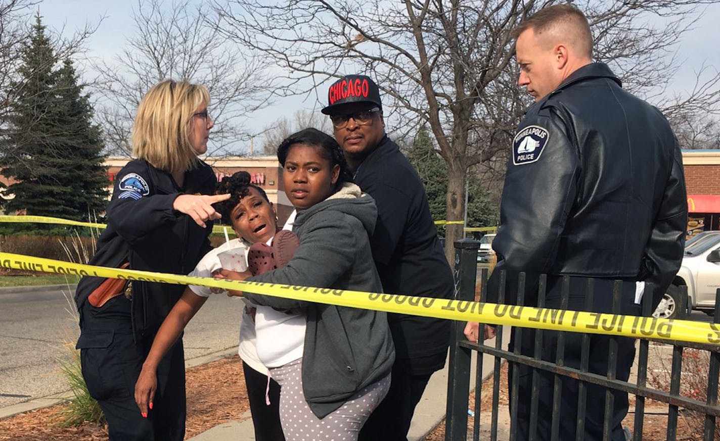 Minneapolis police are investigating a homicide along a busy thoroughfare on the city's north side Thursday. A woman, who identified herself as the victim's mother, was consoled at the scene by officers and K.G. Wilson, a local activist.