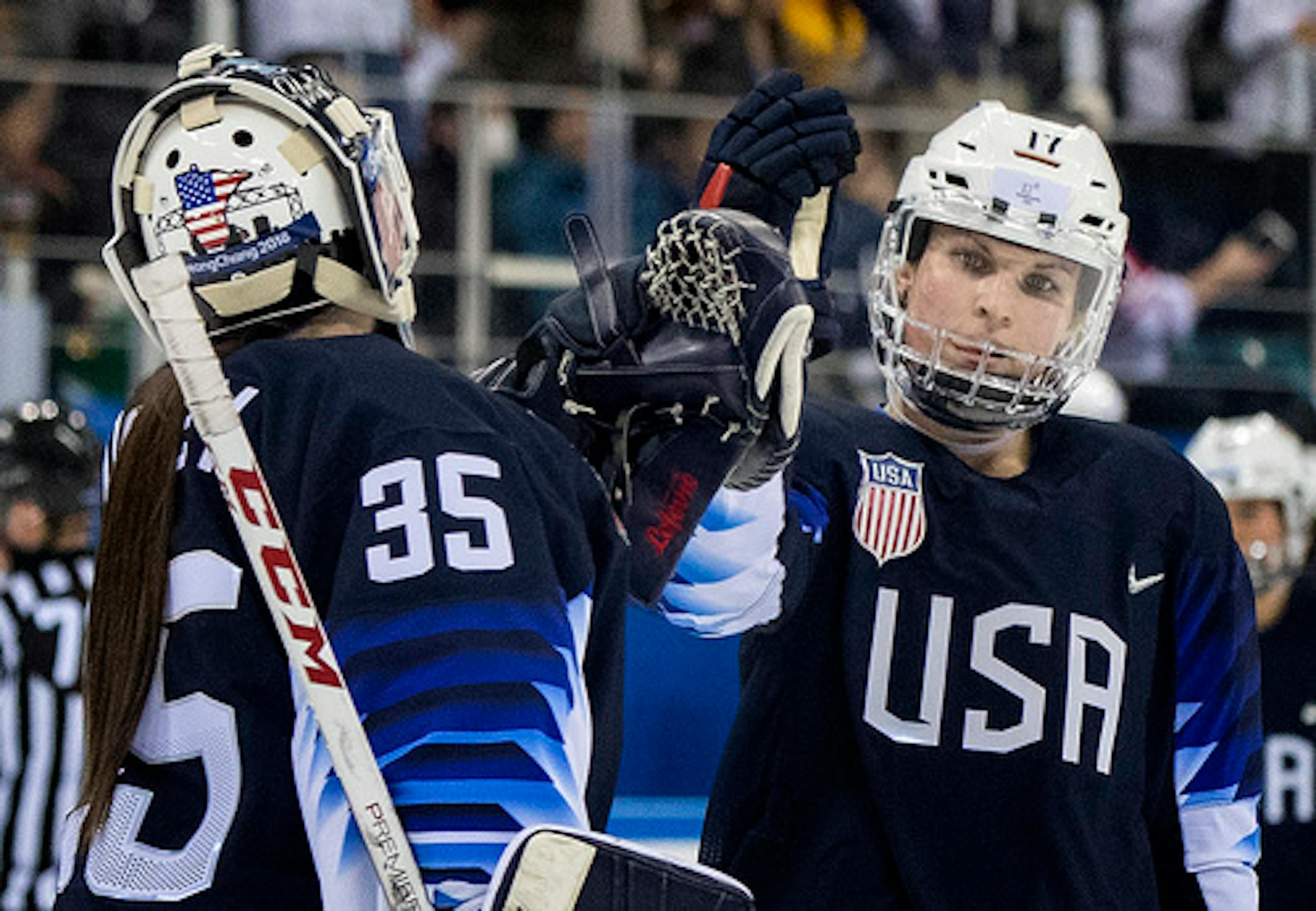Jocelyne Lamoureux-Davidson, right, celebrated with goalie Maddie Rooney during the 2018 Winter Olympics