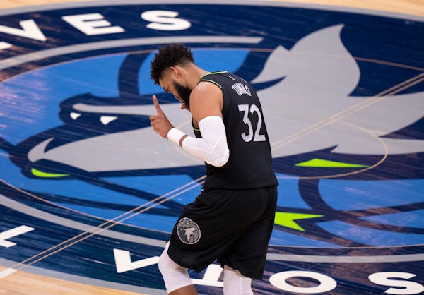 Minnesota Timberwolves center Karl-Anthony Towns (32) celebrated in a low key style after a first quarter basket. ] JEFF WHEELER • jeff.wheeler@star