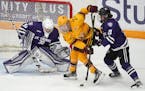 Gophers forward Savannah Norcross (27) tried to get the puck past St. Thomas goaltender Alexa Dobchuk when the women’ teams met Jan. 8 at Ridder Are