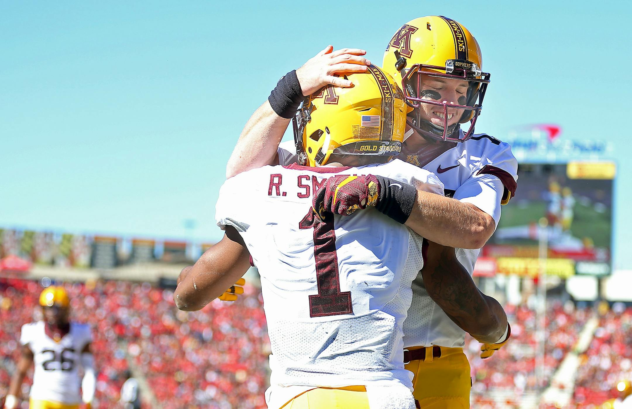 Minnesota quarterback Conor Rhoda and running back Rodney Smith after Smith ran the ball into the end zone for a touchdown in the second quarter at Maryland.
