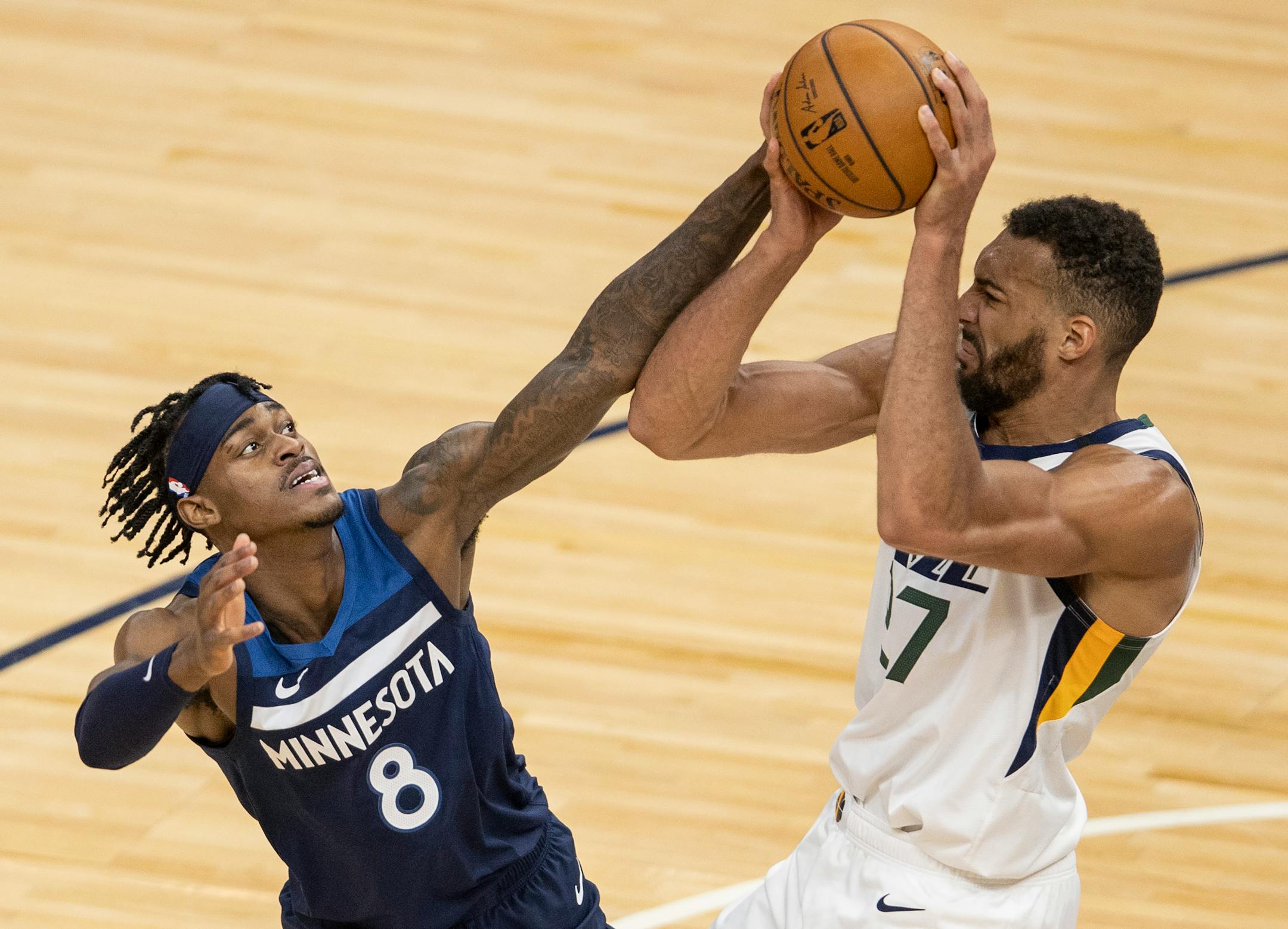 Jordan Mclaughlin (6) of the Minnesota Timberwolves and Rudy Gobert (27) of the Utah Jazz fought for the ball in the second quarter.
