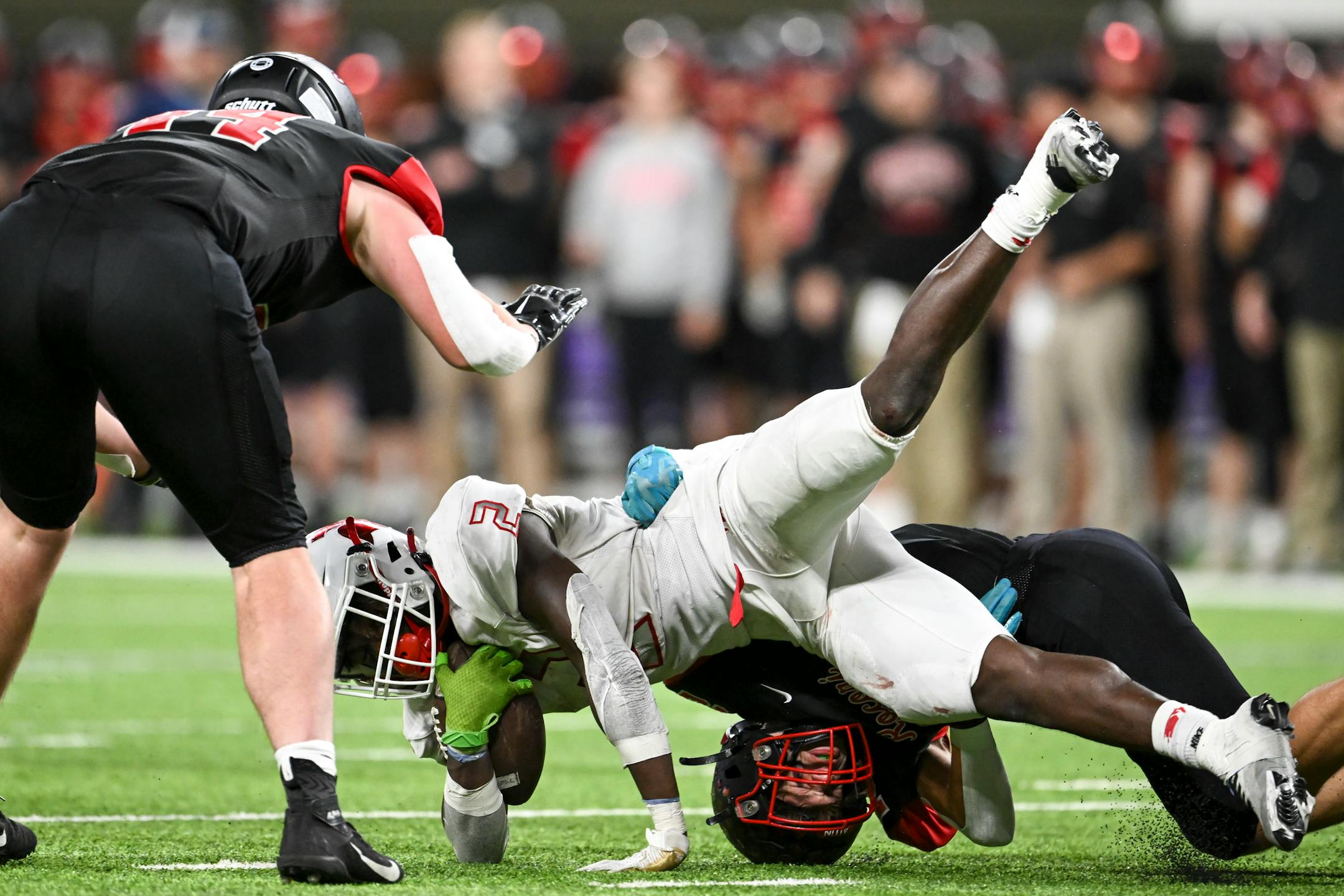 Simley wide receiver La'tayvion McCoy-Nunn (2) is tackled by Rocori defensive back Gabe Johnson (22) during a run in the second half.