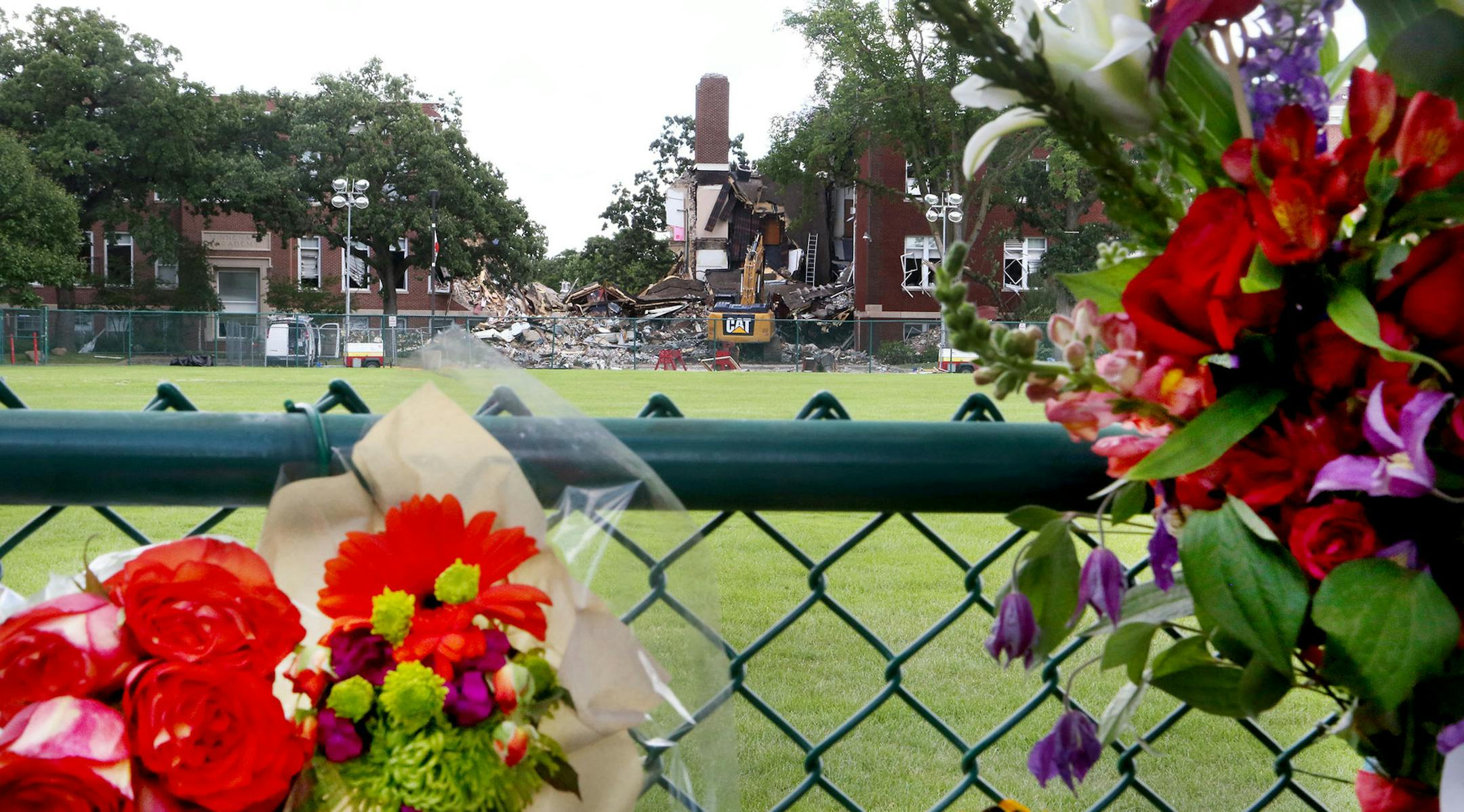 A growing memorial to the victims is visible two days after an explosion and building collapse at Minnehaha Academy that left two dead and several injured and seen Friday, Aug. 4, 2017, in Minneapolis, MN.] DAVID JOLES &#xef; david.joles@startribune.com Two days after an explosion and building collapse at Minnehaha Academy that left 2 dead and several injured