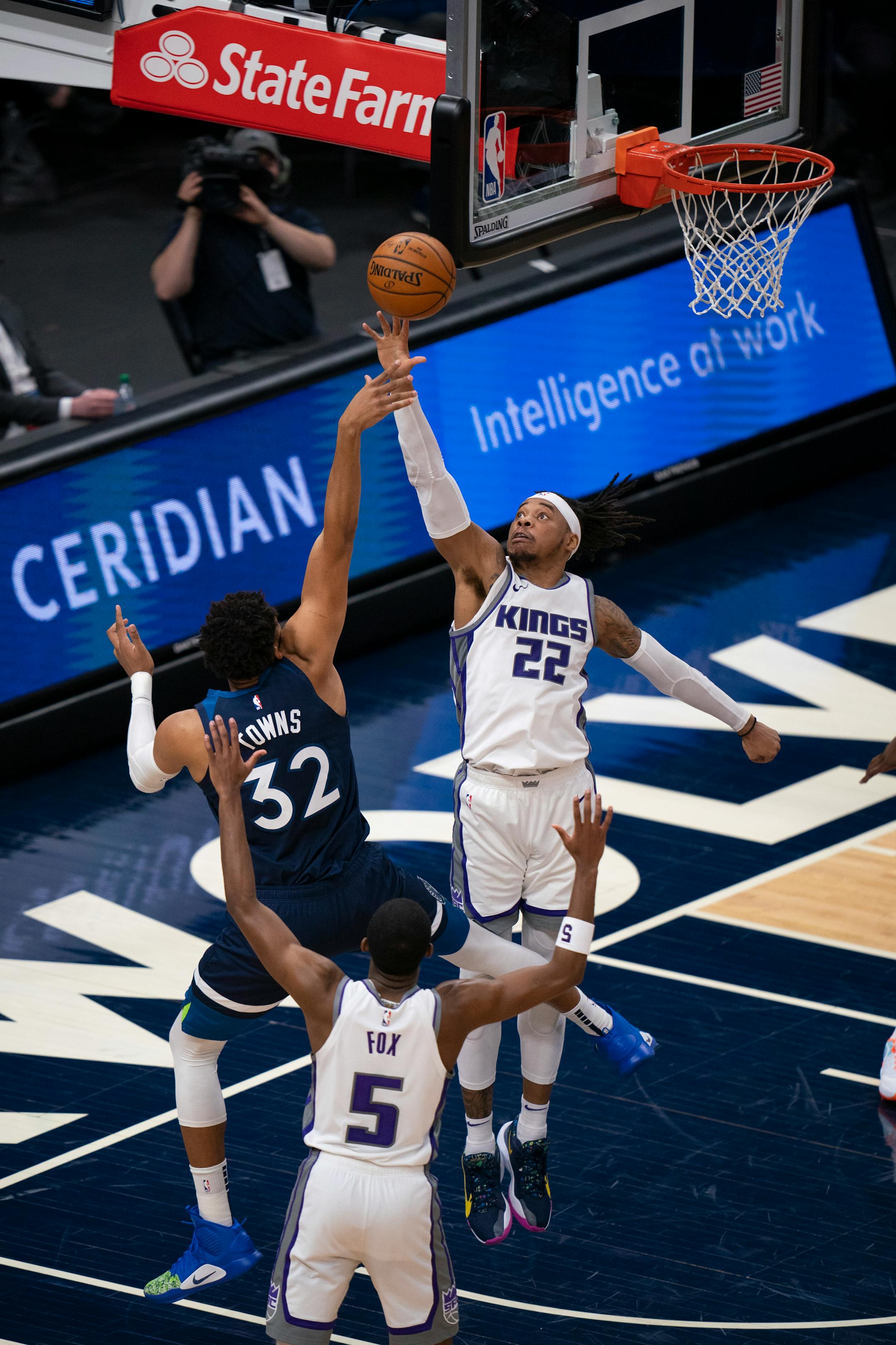 Sacramento Kings center Richaun Holmes (22) blocked a shot by Minnesota Timberwolves center Karl-Anthony Towns (32) in the second quarter.