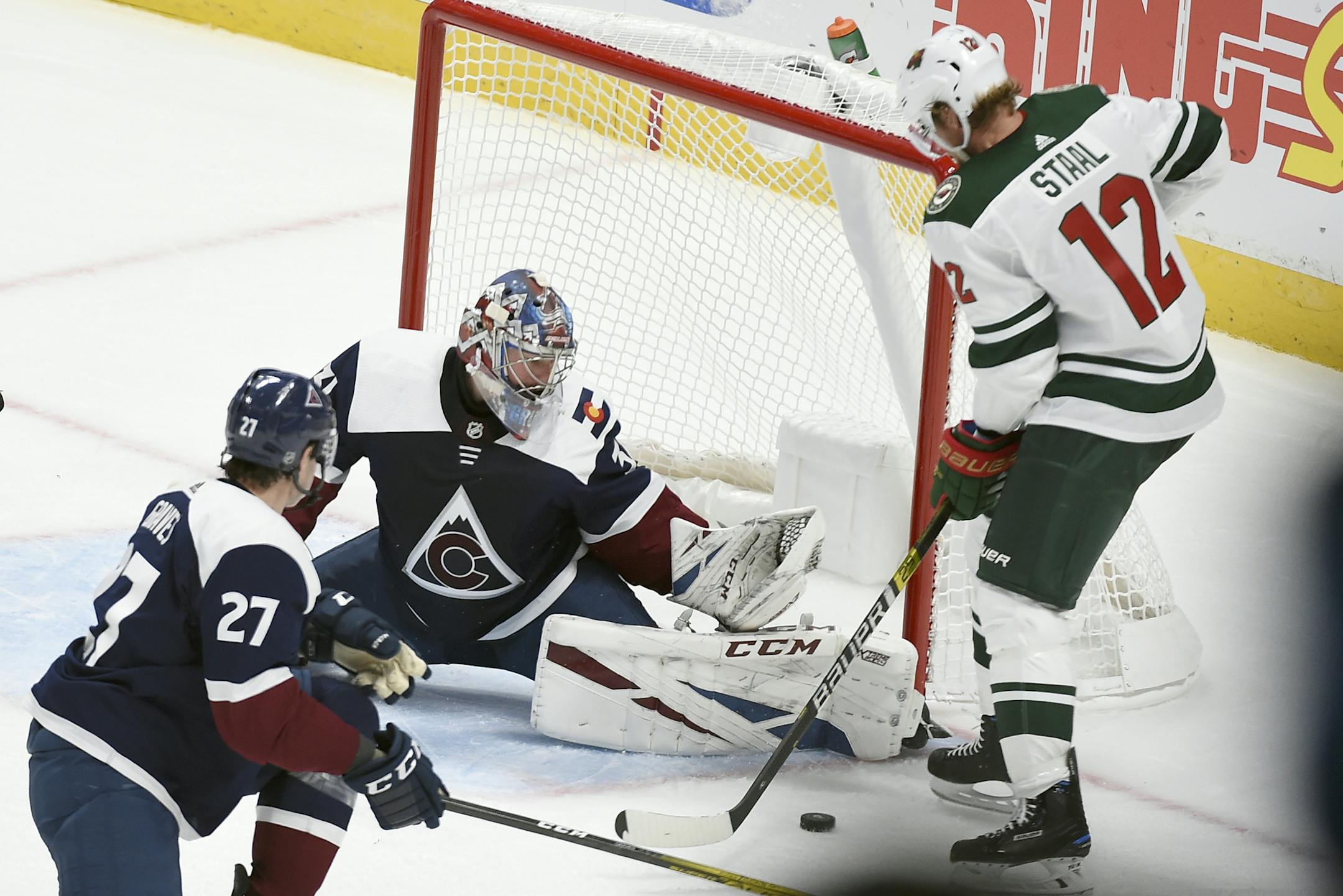 Minnesota Wild center Eric Staal (12) looks to take a shot on Colorado Avalanche goaltender Philipp Grubauer (31) during the third period in an NHL hockey game Saturday, Oct. 5, 2019, in Denver. The Colorado Avalanche defeated the Minnesota Wild 4-2. (AP Photo/John Leyba)