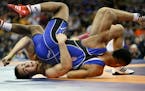 Apple Valley's Mark Hall, right, won his first match Sunday morning against Logan Massa at the 2016 Olympic Team Trials in Iowa City.