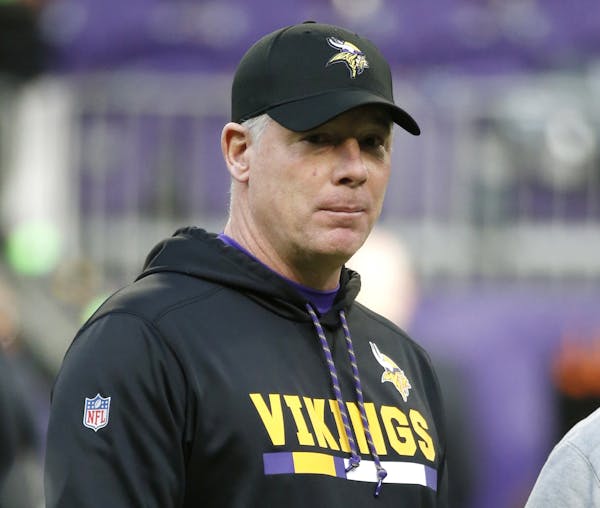 FILE - In this Dec. 31, 2017, file photo, Minnesota Vikings offensive coordinator Pat Shurmur stands on the field before an NFL football game against 