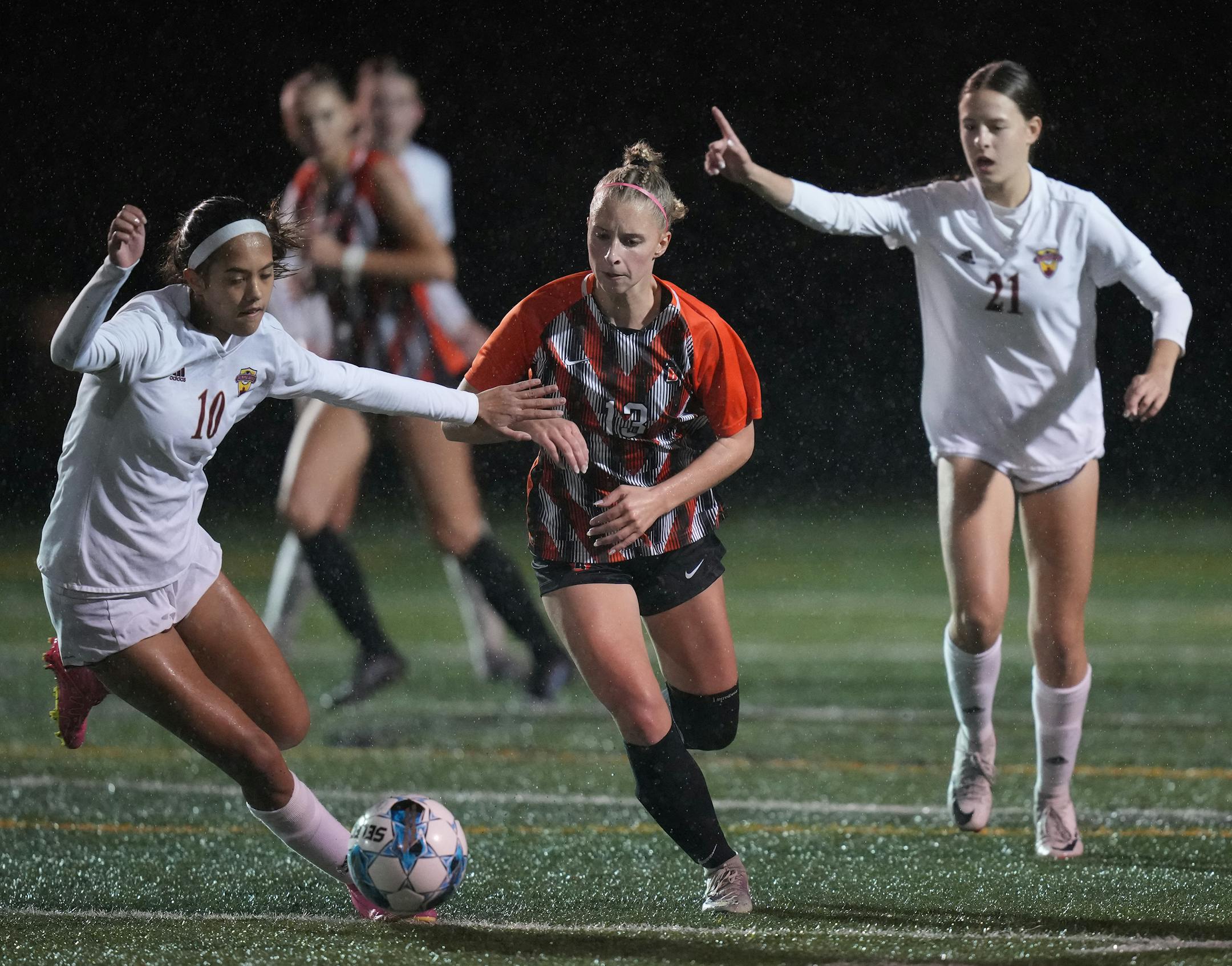 Jessica Lee (10) of Maple Grove controls the ball with Camdyn Bachmeier (13) of White Bear Lake.
